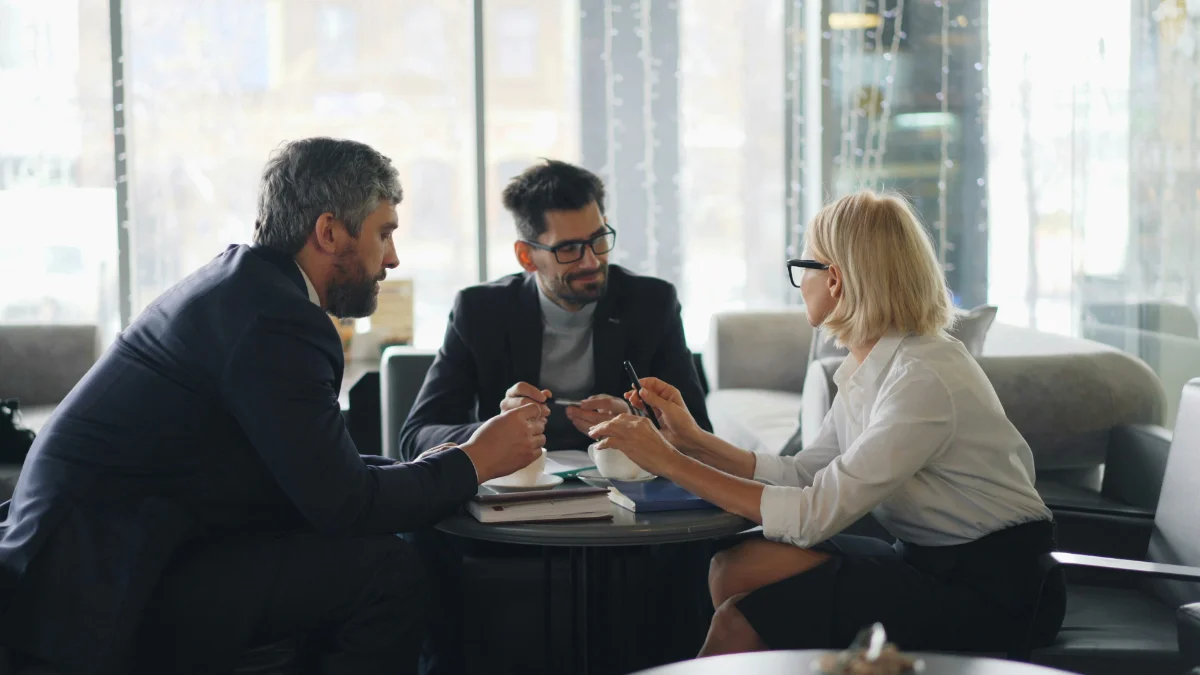 Owner presenting; buyers asking questions